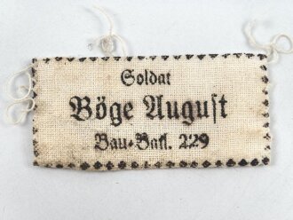 Wäscheetikett für einen Angehörigen im Bau...