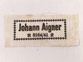 Wäscheetikett des Johann Aigner. Maße 3 x 7cm