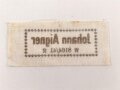 Wäscheetikett des Johann Aigner. Maße 3 x 7cm