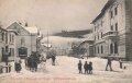 Ansichtskarte "Petersdorf im Riesengebirge im Winter Die Bahnhofsstrasse"