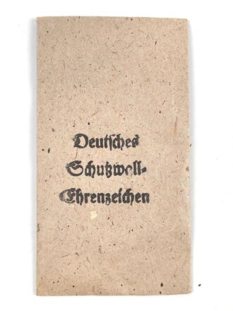 Schutzwall Ehrenzeichen, Zink ohne Band, in originaler Tüte, der Hersteller warum auch immer ausgeschnitten