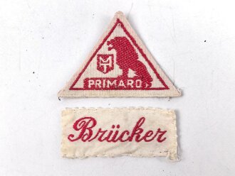 Zwei Wäscheetiketten, je etwa 3cm Breit