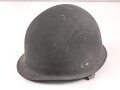 Stahlhelm mit Innenhelm nach dem amerikanischen Modell M1. Originallack, ungereinigtes Stück