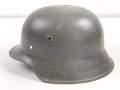 Stahlhelmglocke Wehrmacht Modell 1942. Hersteller NS64, neuzeitlich lackiert, vorne zwei Löcher zugeschweißt.