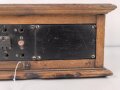 Klappenschrank, sicherlich zivile Ausführung. Maße etwa 15 x 46 x 15cm. Ungereinigt, Funktion nicht geprüft