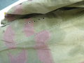 Sumpftarn Feldbluse für einen Angehörigen der Luftwaffen Felddivision. Getragenes Stück mit den original zugehörigen Schulterklappen. Die Feldbluse scheint ohne Brustadler getragen worden zu sein