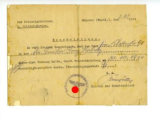 Bescheinigung der Schutzpolizei in Münster über die Zerstörung eines Hauses durch Feindeinwirkung, datiert 1944, alt aufgeklebt