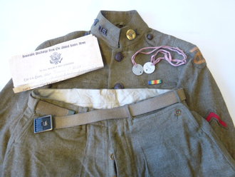 U.S. WWI, 90Th Division group. Tunic and pants with hard to find belt, Dog tags, Discarge and booklet. Nice group, all belongs to Francis L. Wilt