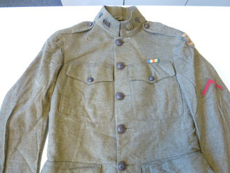 U.S. WWI, 90Th Division group. Tunic and pants with hard to find belt, Dog tags, Discarge and booklet. Nice group, all belongs to Francis L. Wilt
