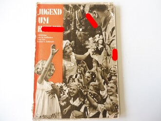 "Jugend um Hitler" 120 Bilder von H.Hoffmann. DIN A5, im Schutzumschlag. Innen an 5 Stellen leicht vermalt