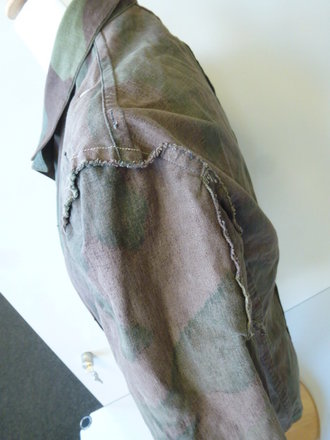 Tarnjacke Wehrmacht aus italienischem Material. Leicht getragenes Stück in gutem Zustand, Schulterbreite: 46 cm, Armlänge 58 cm