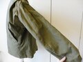 US WWII, M41 Field Jacket. Well used, good size, Original patch but resewn, shoulder width 49 cm, arms length 61 cm