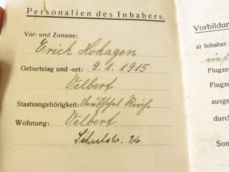 Ritterkreuzträger Major Erich Hohagen, Staffelkapitän JG51 Me 109. Persönliches Flugprüfungsbuch, Versetzungsgesuch mit eigenhändiger Unterschrift sowie diverse Originalfotos.