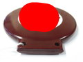 Fahrrademblem schwarzlackiertes Hakenkreuz auf weiß in rotbraunem Preßstoffrahmen. Ungebrauchtes Stück, bei einem der HK ca. 10% Farbverlust. Höhe insgesamt 80mm