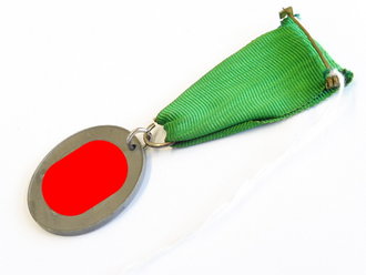 Medaille Pirmasenser Heimkehr 1940.Zink, gelocht, am konfektionierten Band. Durchmesser 33mm, Rückseitig Sonnenrad