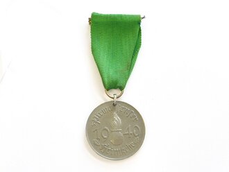 Medaille "Pirmasenser Heimkehr 1940".Zink, gelocht, am konfektionierten Band. Durchmesser 33mm, Rückseitig Sonnenrad