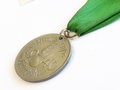 Medaille "Pirmasenser Heimkehr 1940".Zink, gelocht, am konfektionierten Band. Durchmesser 33mm, Rückseitig Sonnenrad