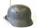 Heer, Stahlhelm M35. Im Krieg wiederaufbereitetes Stück, mit leichtem Rautarn versehen. Leicht getragenes Stück