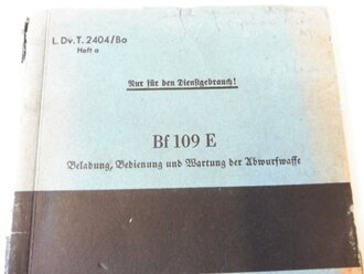 L.Dv.T.2404/Bo, Haft a. " Einsatz der Schlachtfliegerbombe SD2 in BF109 E und F" vom März 1941.  Kleinformat, 12 Seiten plus 10 Abbildungen.