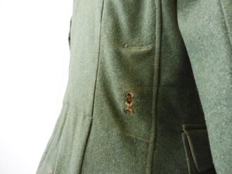 Feldbluse M36 für einen Unteroffizier der Infanterie. Getragenes Kammerstück in gutem Zustand.