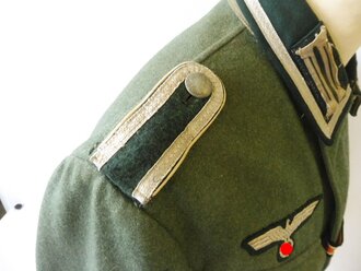 Feldbluse M36 für einen Unteroffizier der Infanterie. Getragenes Kammerstück in gutem Zustand.