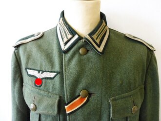 Feldbluse M36 für einen Unteroffizier der Infanterie. Getragenes Kammerstück in gutem Zustand.