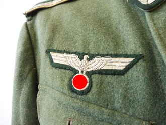 Feldbluse M36 für einen Unteroffizier der Infanterie. Getragenes Kammerstück in gutem Zustand.