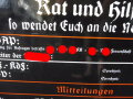 Emailleschild "Hier spricht die NSDAP" 64 x 78cm, auf Holzrahmen aufgeschraubt. Diverse kleinere Reparaturstellen