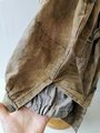 Luftwaffe Fallschirmjäger Knochensack sumpftarn. Stark getragenes Stück mit original vernähtem Adler. Alle vier "RiRi" Kunststoffreissverschlüsse gängig, die Druckknöpfe teilweise defekt. Interessantes Stück aus den letzten Kriegstagen.