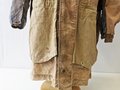 Luftwaffe Fallschirmjäger Knochensack sumpftarn. Stark getragenes Stück mit original vernähtem Adler. Alle vier "RiRi" Kunststoffreissverschlüsse gängig, die Druckknöpfe teilweise defekt. Interessantes Stück aus den letzten Kriegstagen.