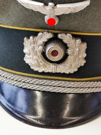 Schirmmütze für einen Offizier der Nachrichtentruppe, Hersteller Erel, Kopfgrösse 56. Getragenes Stück