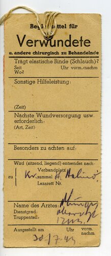 Begleitzettel für Verwundete für einen Obergefreiten mit Granatsplitter datiert 1943