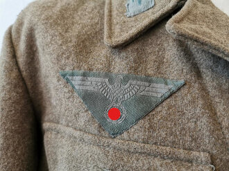 Heer, Feldbluse Modell 1944, Kammerstück in gutem Zustand, die Effekten original vernäht