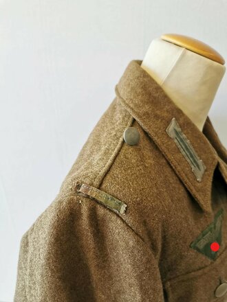 Heer, Feldbluse Modell 1944, Kammerstück in gutem Zustand, die Effekten original vernäht