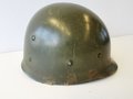 U.S. WWII steel helmet liner made by Westinghouse. Later war OD interieur, original paint