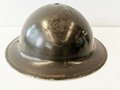 British 1942 dated steel helmet , due to service after the war repainted and new model chin strap atttached, liner is 1943 dated, uncleaned