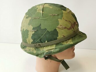 U.S. Vietnam war steel helmet. Mitchell cover dated 68