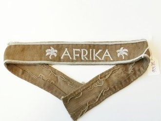 Ärmelband "Afrika", Länge 49cm, Spuren von Stecknadeln