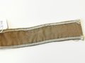 Ärmelband "Afrika", Länge 49cm, Spuren von Stecknadeln