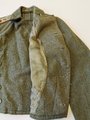 Sturmgeschützjacke für einen Oberleutnant der Panzerjäger mit original vernähten Effekten, der Brustadler abgetrennt. Kammerstück in sehr gutem Zustand