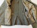 Sturmgeschützjacke für einen Oberleutnant der Panzerjäger mit original vernähten Effekten, der Brustadler abgetrennt. Kammerstück in sehr gutem Zustand