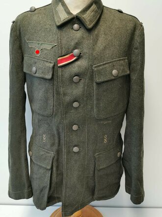 Heer, Feldbluse Modell 1943. Kammerstück mit original vernähten Effekten in  gutem Zustand