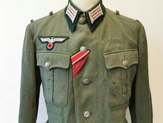 Heer, Feldbluse Modell 1936 für Mannschaften, die Kragenspiegel für Offiziere der Panzertruppe höchstwahrscheinlich original vernäht, der Brustadler  neuzeitlich vernäht. Stärker getragenes Stück