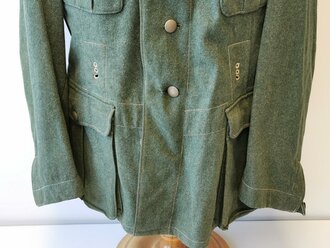 Heer, Feldbluse für Mannschaften Modell 1935. Getragenes Stück in gutem Gesamtzustand, der Adler neuzeitlich vernäht