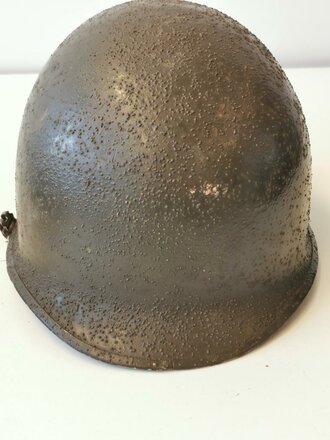 U.S. M1 steel helmet. Front seam WWII shell with later...
