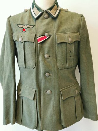 Heer, Feldbluse Modell 1936 für einen Unteroffizier. Getragenes Stück, die Effekten original vernäht, Kammerstück in sehr gutem Zustand