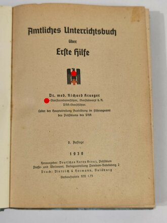 Amtliches Unterrichtsbuch über Erste Hilfe , komplett, Einband verschmutzt