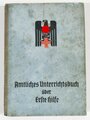 Amtliches Unterrichtsbuch über Erste Hilfe , komplett, Einband verschmutzt