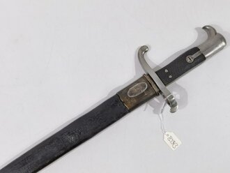 Preußen, Hirschfänger M 1865  für die Jägerbüchse. Hersteller  Neuhaus, Kammerstück mit 3 Nieten von 1867.  Parierstangenring ausgebuchst für die Jägerbüchse M 1871.. Lederscheide geschrumpft, sonst guter Gesamtzustand