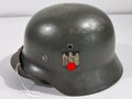 Kriegsmarine, Stahlhelm Modell 1935. In allen Teilen Originales, zusammengehöriges  Stück, das rechte Wappen laut Vorschrift von 1940 entfernt. Das Hakenkreuz des Adlers zu 98% erhalten